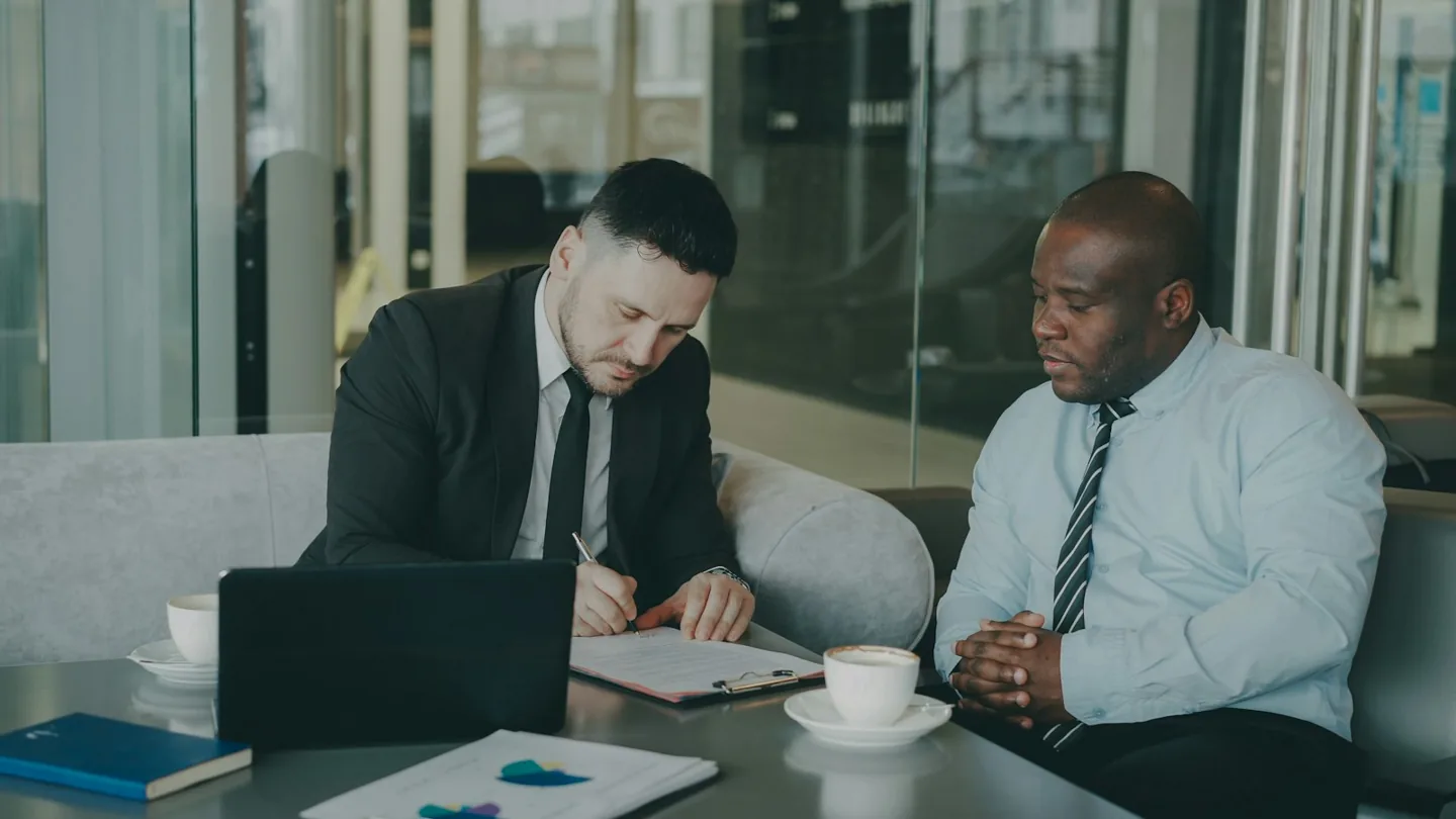 Business partners reviewing documents together