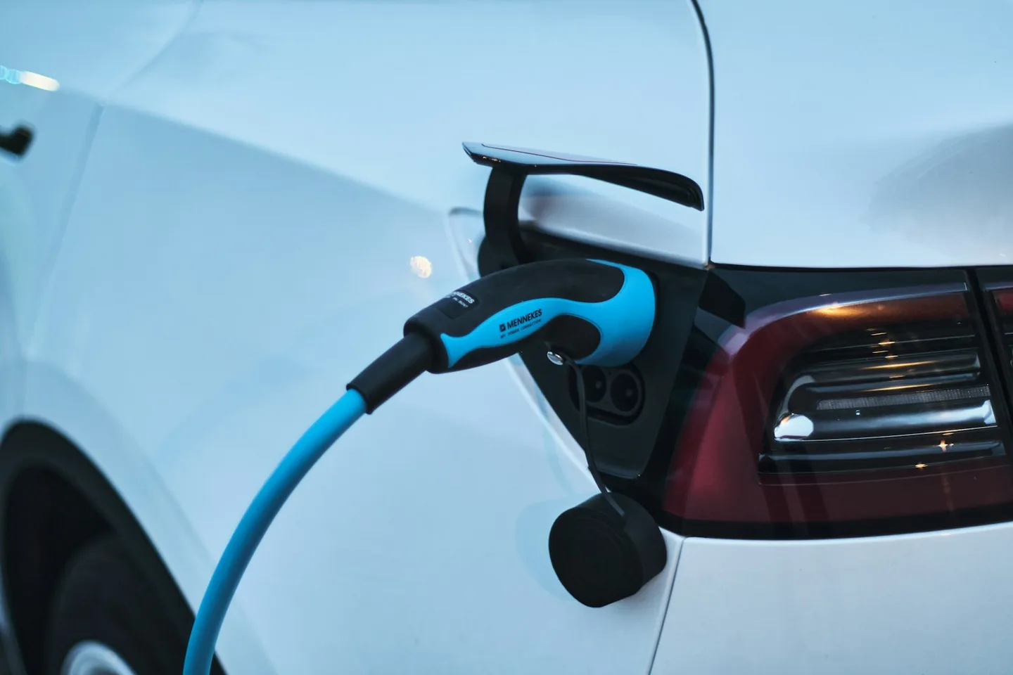 An electric vehicle connected to a charging cable