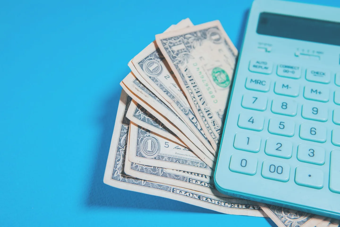 US dollars and a calculator for budgeting
